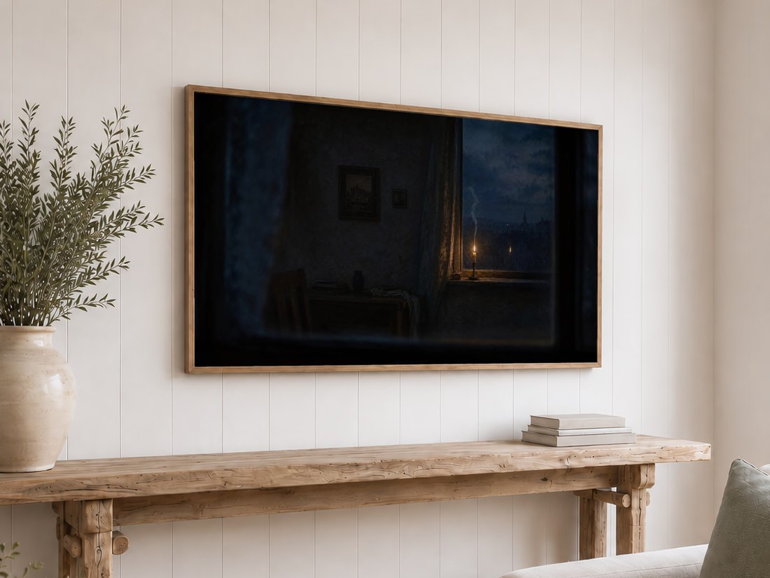 Candlelit twilight window art shown on a Frame TV in an oak frame against a white shiplap wall, above a reclaimed-wood console with olive branches and neutral books, deep blue and amber tones for a calm interior.