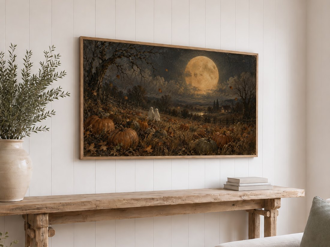 Ghosts Beneath the Harvest Moon on a Frame TV above a rustic reclaimed-wood console with olive branches in a cream ceramic vase, displayed on white shiplap wall with light oak frame