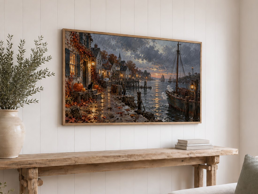 Halloween harbor Frame TV art displayed above a rustic reclaimed-wood console table on a white shiplap wall, with olive branches in a cream ceramic vase and neutral books.