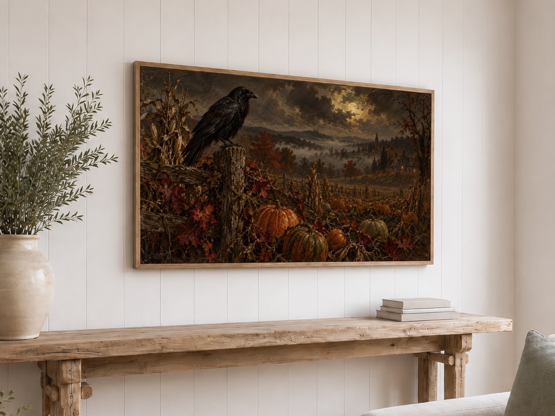 Gothic autumn pumpkin patch frame TV art displayed on white shiplap wall in light oak frame above reclaimed-wood console with cream ceramic vase of olive branches and stacked neutral books.