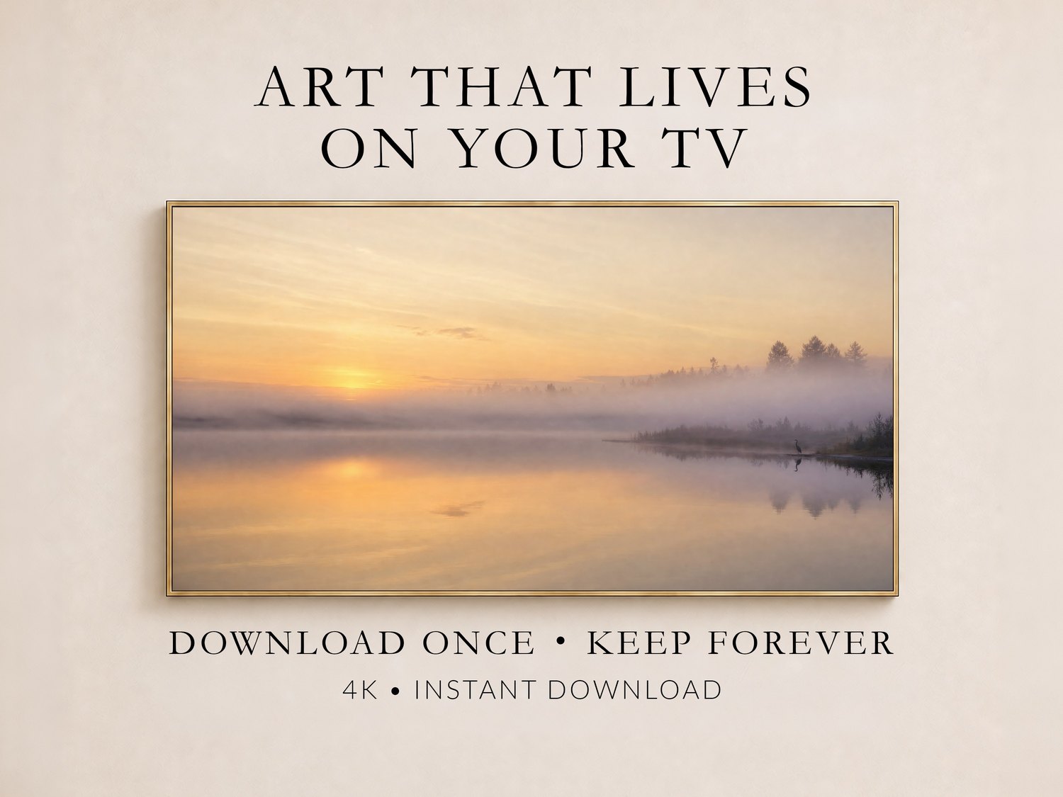 Misty lake sunrise artwork displayed in a thin gold frame on a soft cream wall, showing a heron silhouette by foggy water in amber and lavender tones, promoting instant 4K download art for TVs.