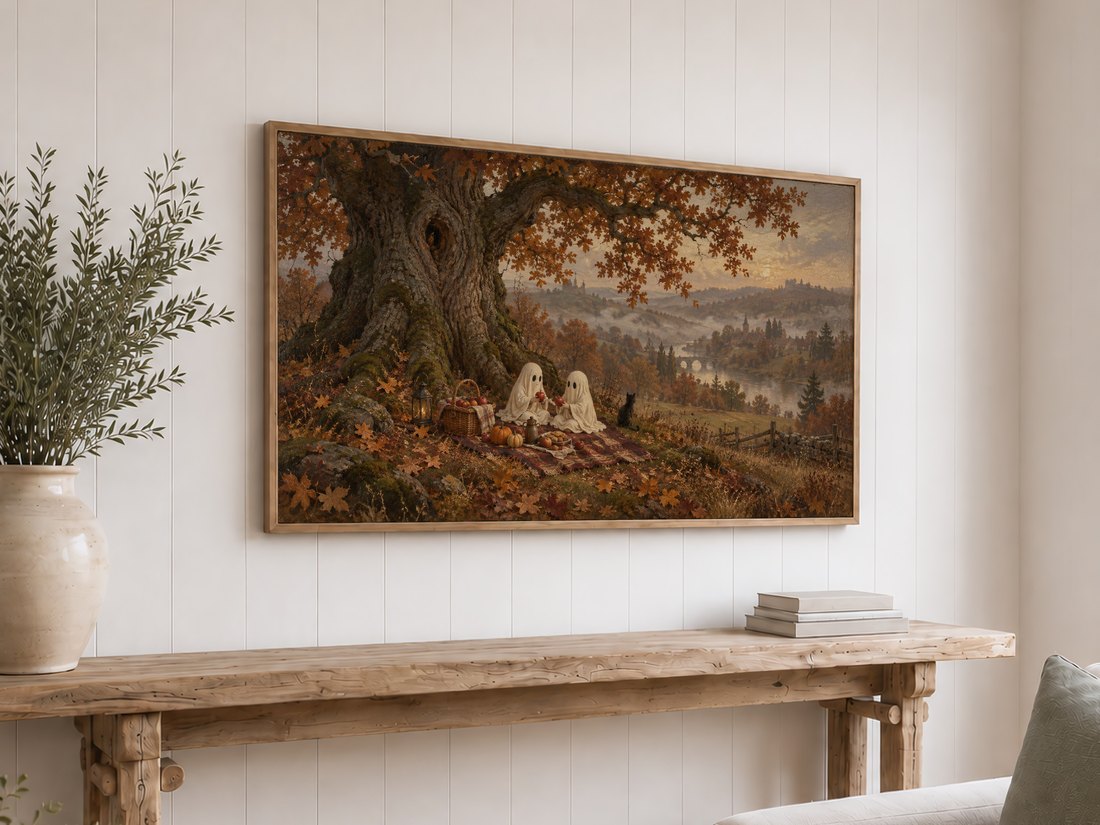 Misty autumn ghost picnic landscape art shown on Frame TV above a rustic reclaimed-wood console table on white shiplap wall, styled with olive branches in cream ceramic vase and neutral books.